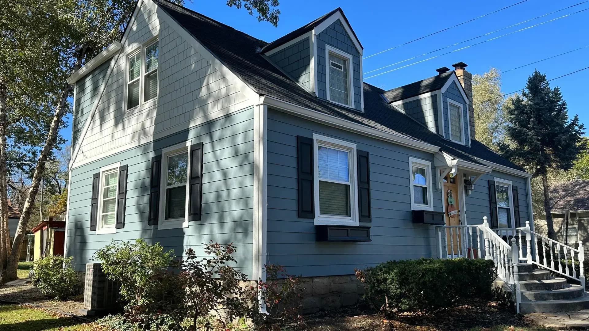 after-blue-james-hardie-siding-installed-on-overland-park-home.webp