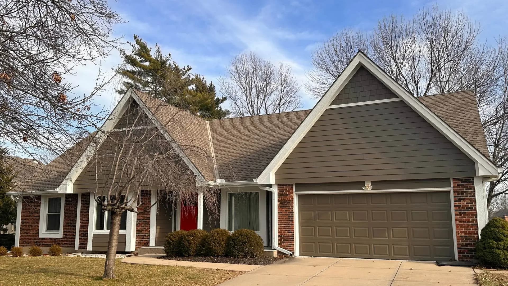 after-new-brown-siding-installed-on-lenexa-home-safe-harbor-exteriors.webp