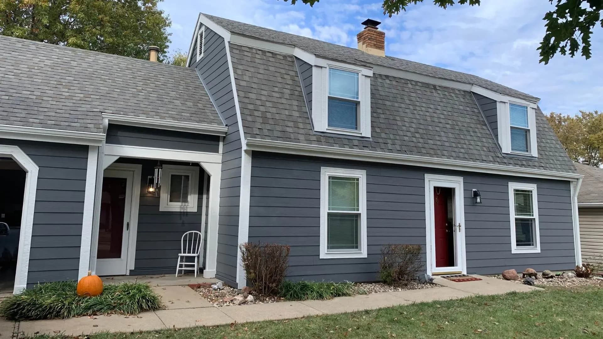 Safe Harbor Exteriors restores Lawrence, KS home with blue James Hardie Siding, windows and gutters