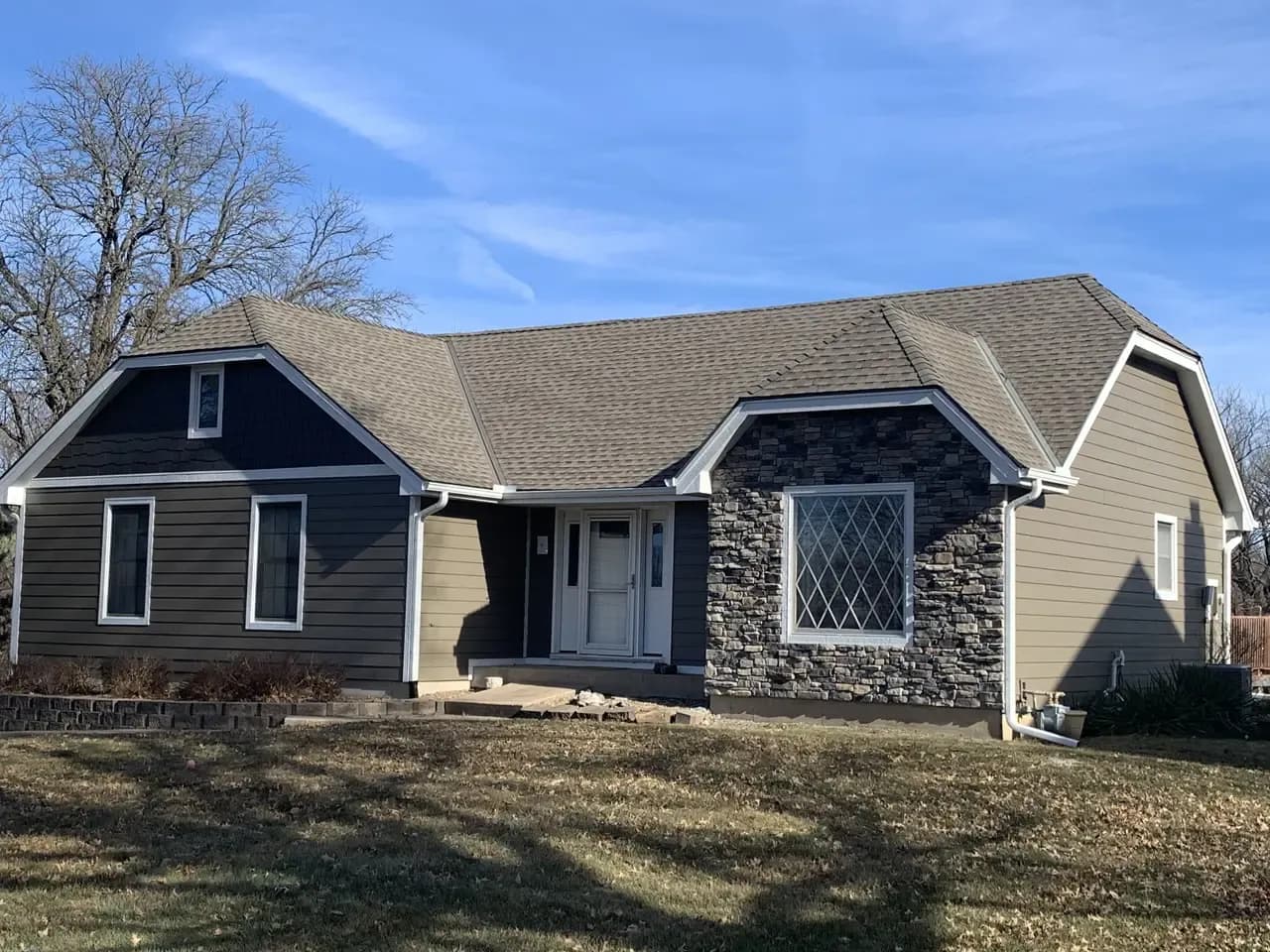Custom Stone and Hardie siding installed on a home by Safe Harbor Exteriors