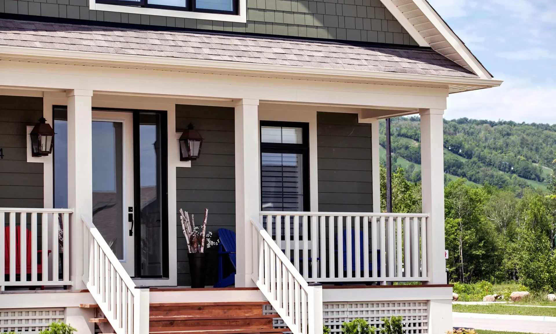 Gray and white house with James Hardie Siding and a porch.