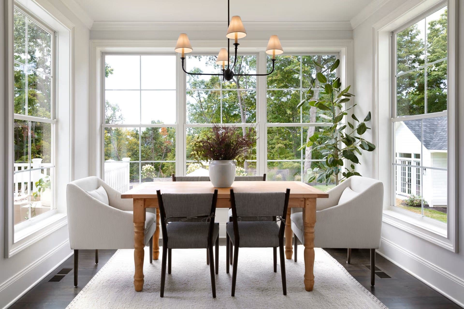 A dining room nook with Marvin Essential double hung windows.