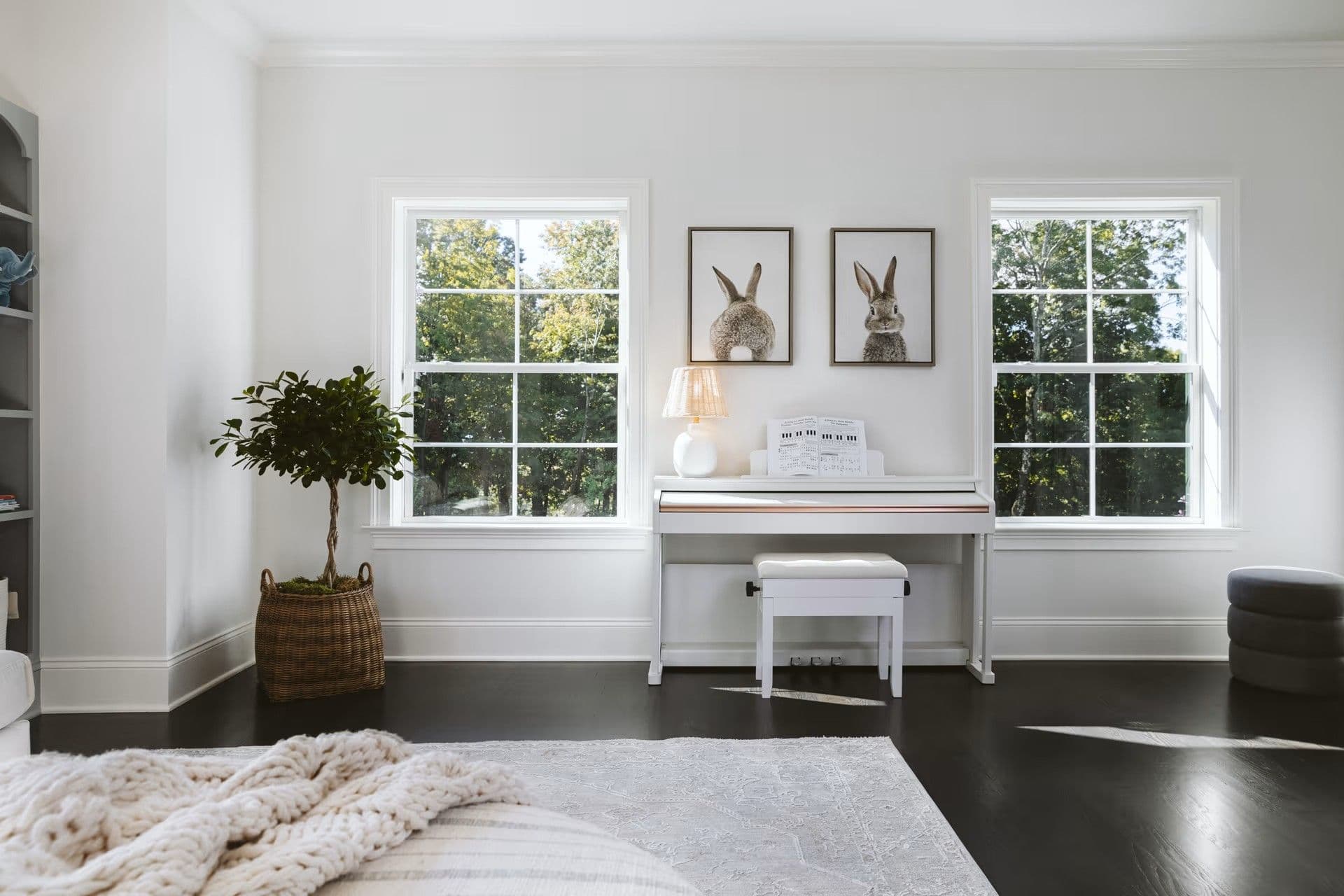 Marvin Essential double-hung windows in a white bedroom.