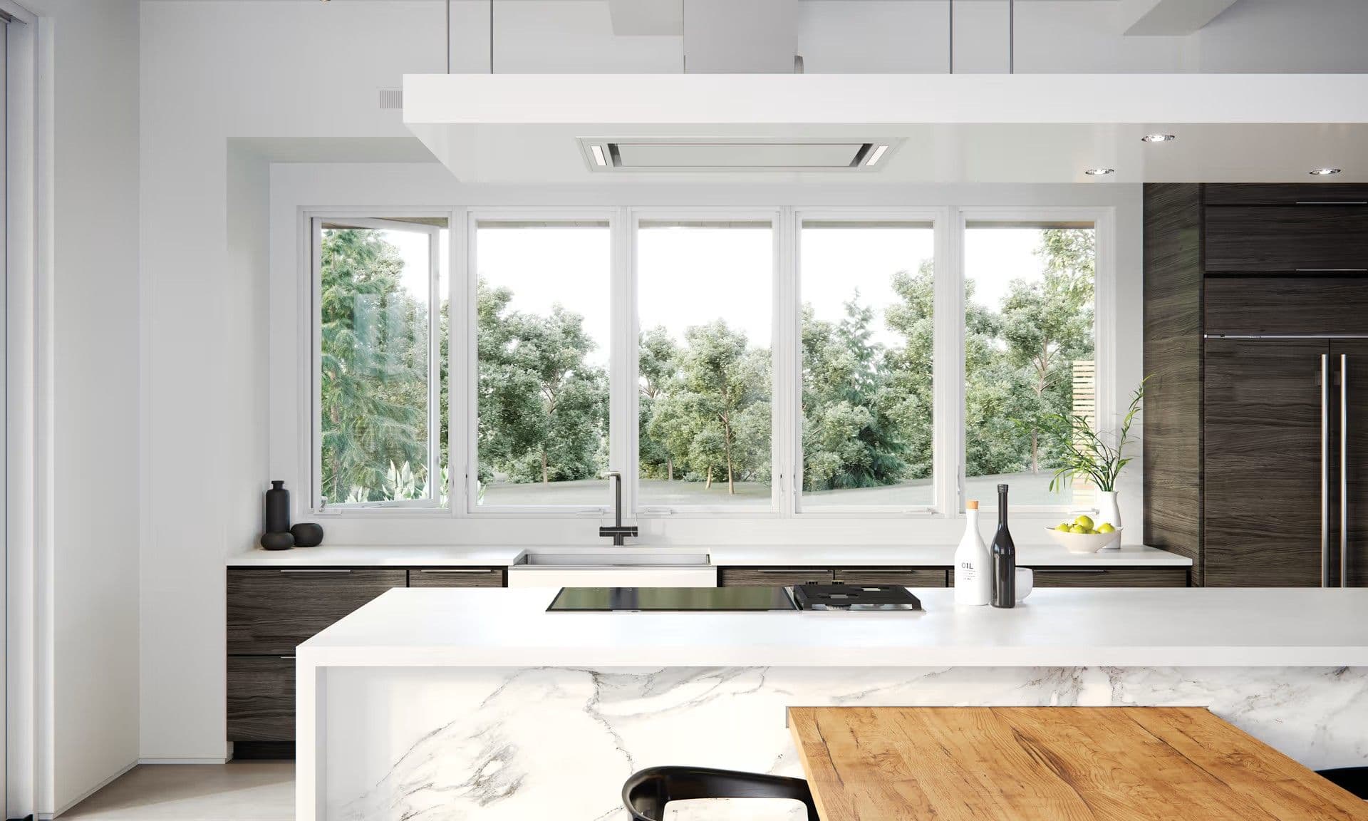 Modern white kitchen with outdoor view through white casement Marvin windows.