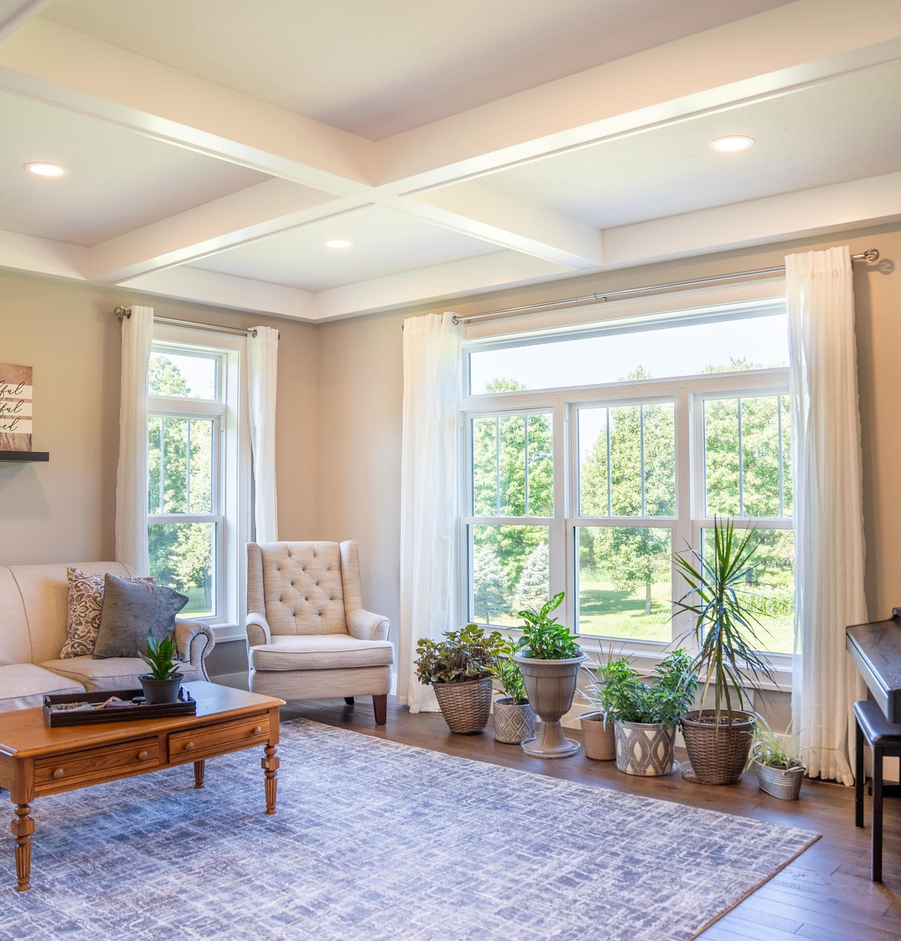 Inside view of ProVia Endure double hung windows in white with transoms.
